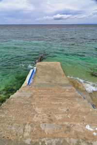 0573 concrete stairway leading to a low rise jetty covered by the high tide. oslob-cebu island-rph