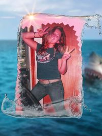 Midsection of woman in sea against sky