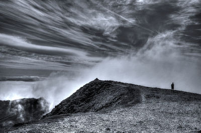Scenic view of waterfall against sky