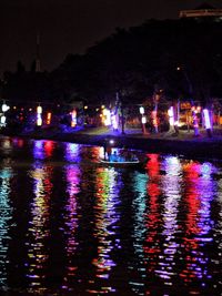 Reflection of trees in water at night