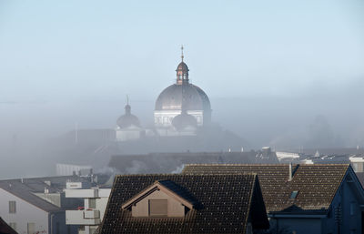 View of buildings in city against sky