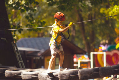 Side view of woman exercising in park