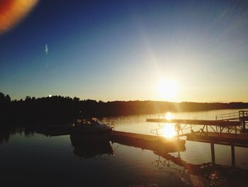 Scenic view of river at sunset