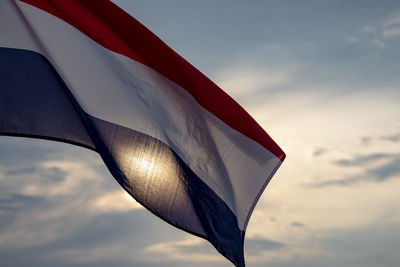 Low angle view of flag against sky