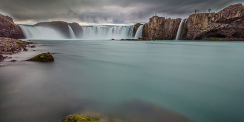 Dreamy low-angle view of the splendid godafoss waterfalls during a brief icelandic summer