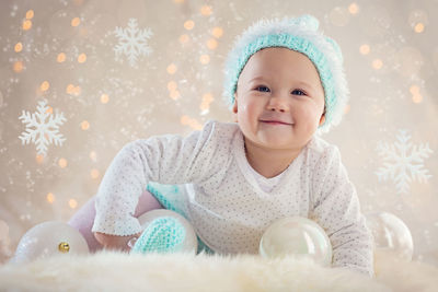 Portrait of cute smiling boy in snow