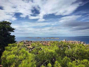 Scenic view of sea against cloudy sky