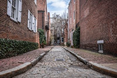 Alley amidst buildings in town