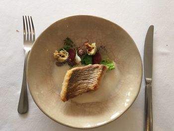 Close-up of bread in plate on table