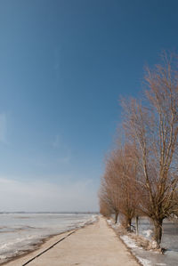 Scenic view of snow covered landscape against sky