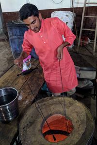 Man working on barbecue grill