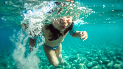 Portrait of young girl in swimming