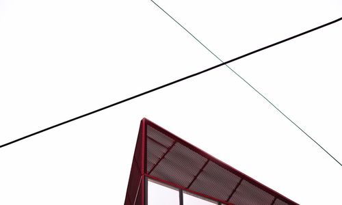 Low angle view of suspension bridge against clear sky