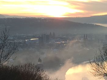 High angle view of city at sunset