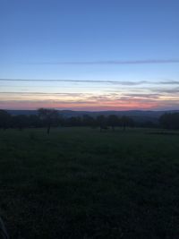 Scenic view of landscape against sky during sunset