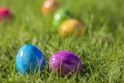 Close-up of easter eggs on grassy field