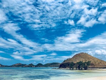 Scenic view of sea against blue sky