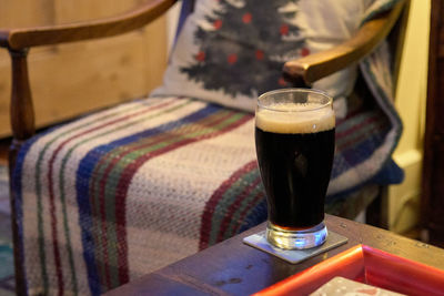 Close-up of beer glass on table