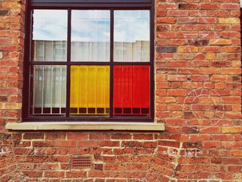 Close-up of window on brick wall