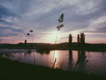 Scenic view of lake against sky during sunset