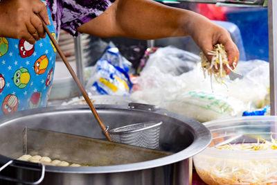 Midsection of person preparing food