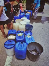 Low section of people standing on street