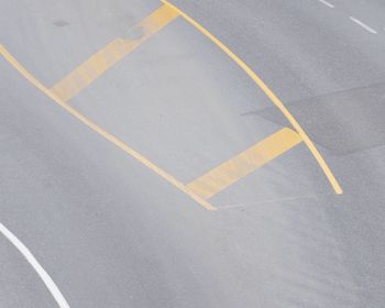 High angle view of arrow symbol on road