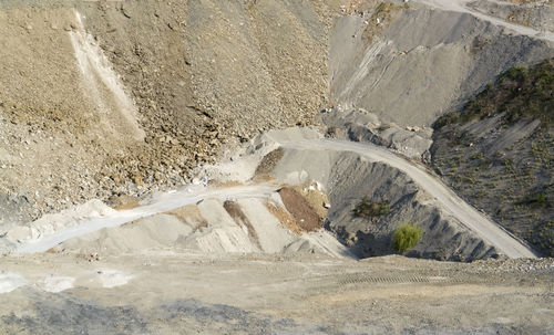 High angle view of tire tracks on road