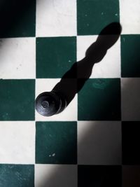 High angle view of chess pieces on floor
