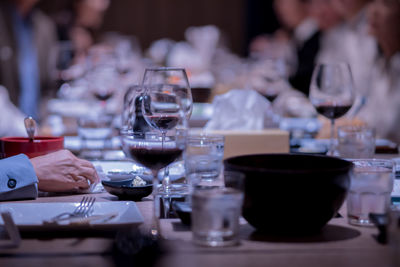 Glass of wine on the table for a company party in a fine dining restaurant at night