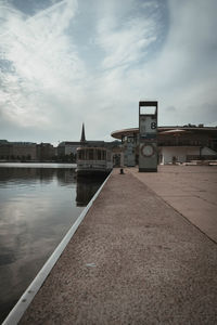 Bridge over river against buildings