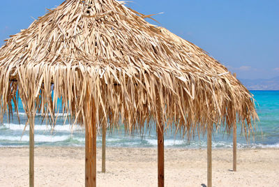 Sun umbrellas row on the beach.