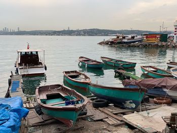 Boats moored at harbor