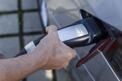 Charging of an electric car, close-up