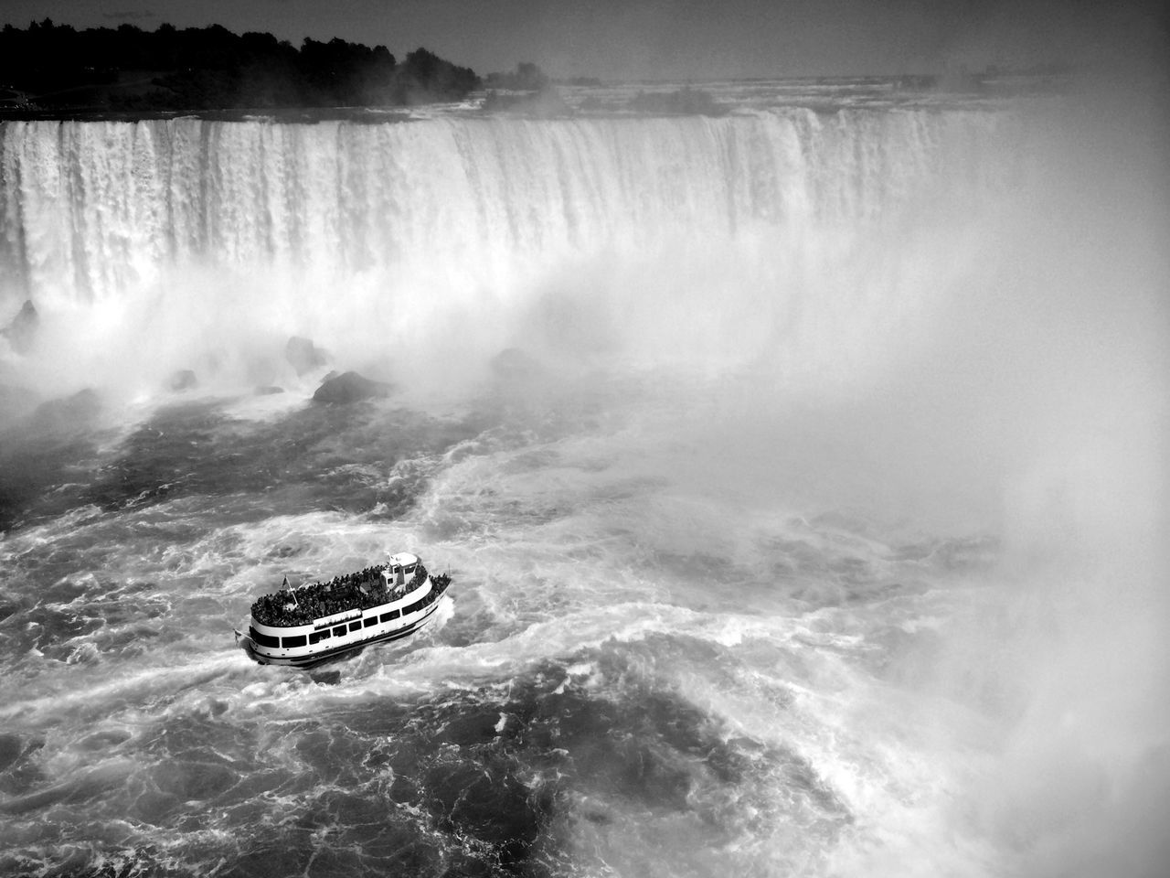 water, waterfront, motion, sea, beauty in nature, nature, scenics, nautical vessel, transportation, rock - object, travel, adventure, tranquility, mode of transport, boat, surf, outdoors, tranquil scene, day, idyllic