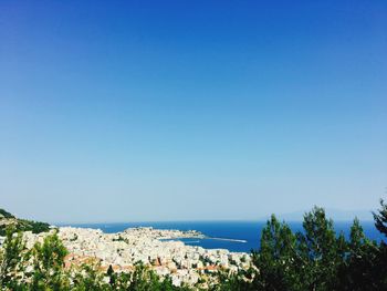 Scenic view of sea against clear blue sky