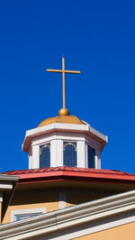 Low angle view of building against clear blue sky