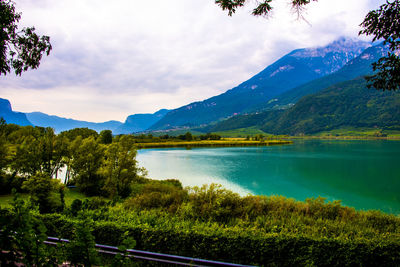 Photo of lake caldaro enclosed in the mountains in bolzano italy