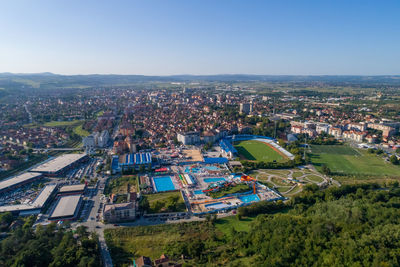 High angle view of buildings in city against clear sky