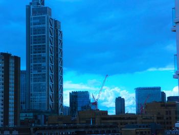 Low angle view of modern buildings against sky