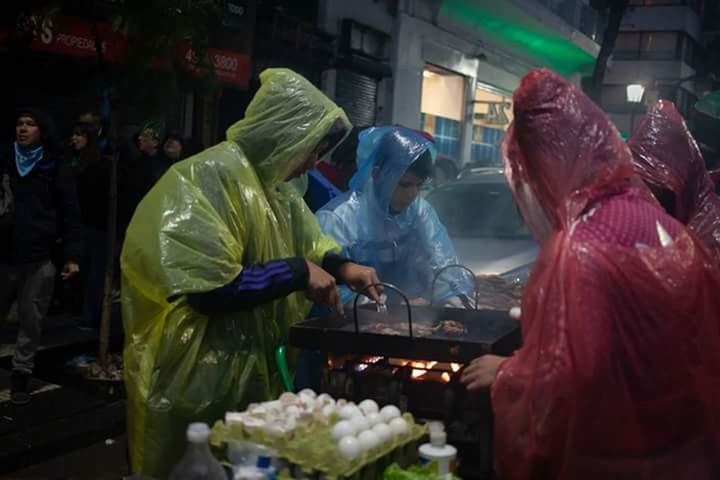 food and drink, food, group of people, occupation, preparation, freshness, people, market, healthy eating, business, standing, retail, adult, vegetable, men, waist up, outdoors, customer, working, preparing food, chef