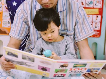 Close-up of boy playing with toys