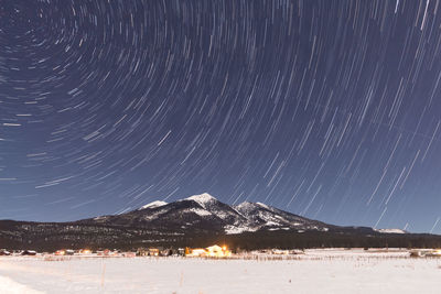 Low angle view of star trail