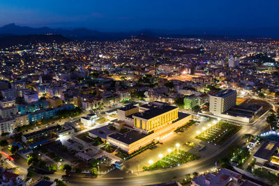 High angle view of illuminated buildings in city at night