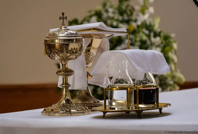Close-up of religious equipment on table