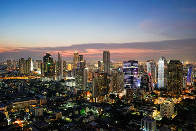 Aerial view of city lit up at night