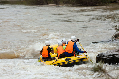 People on boat in river