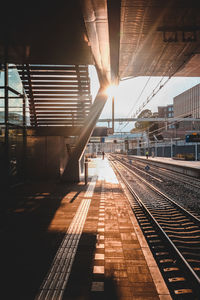 Railroad station platform at sunset