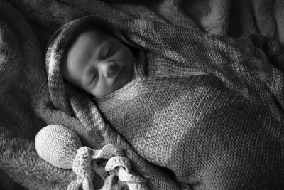 Close-up of a boy sleeping in bed