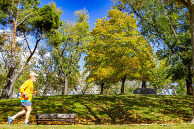 Man standing by plants during autumn